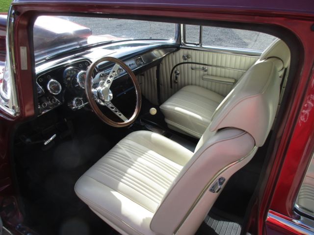 1957 RED MET. Chevrolet Bel Air/150/210 Sedan