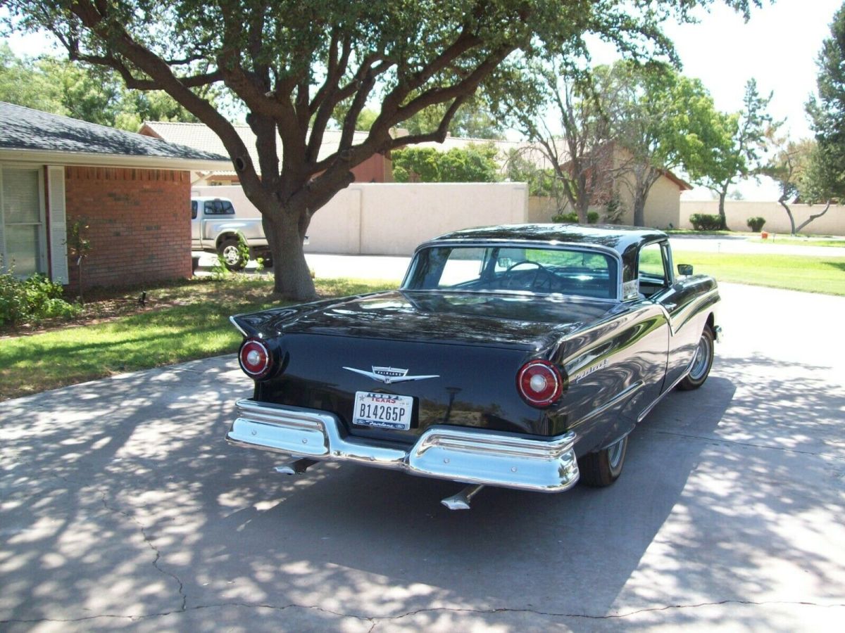 1957 Black Ford Fairlane retractable