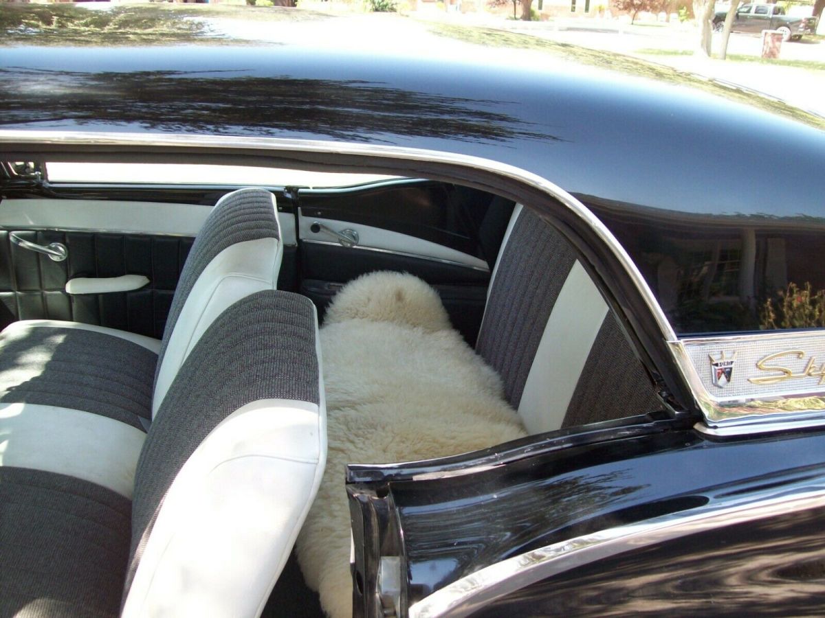 1957 Black Ford Fairlane retractable