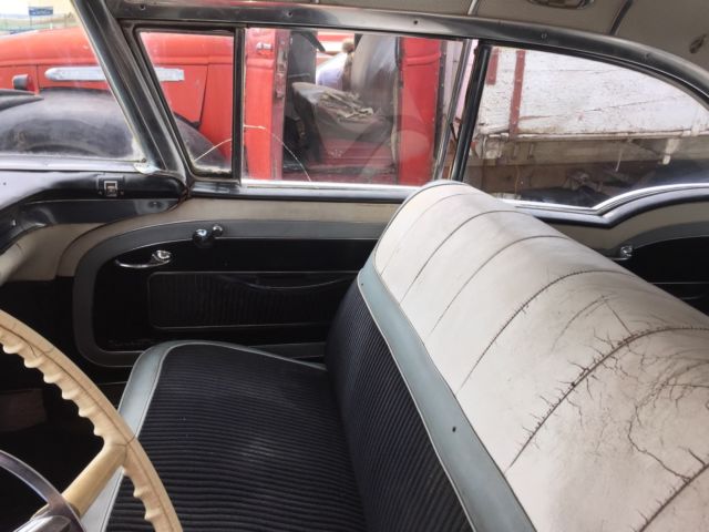 1957 Pink Oldsmobile Ninety-Eight Sedan