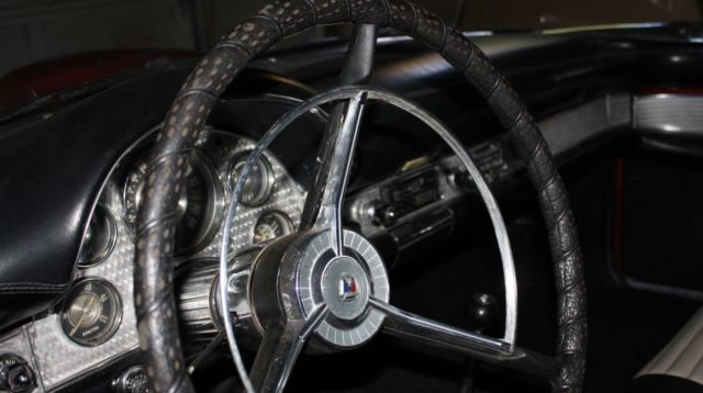 1957 Red Ford Thunderbird Convertible hard top