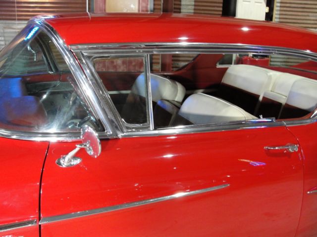 1958 Red Cadillac 62 sport coupe --