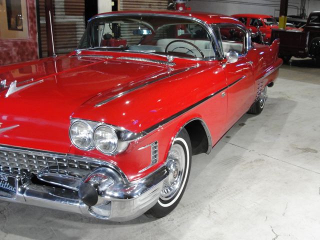 1958 Red Cadillac 62 sport coupe --