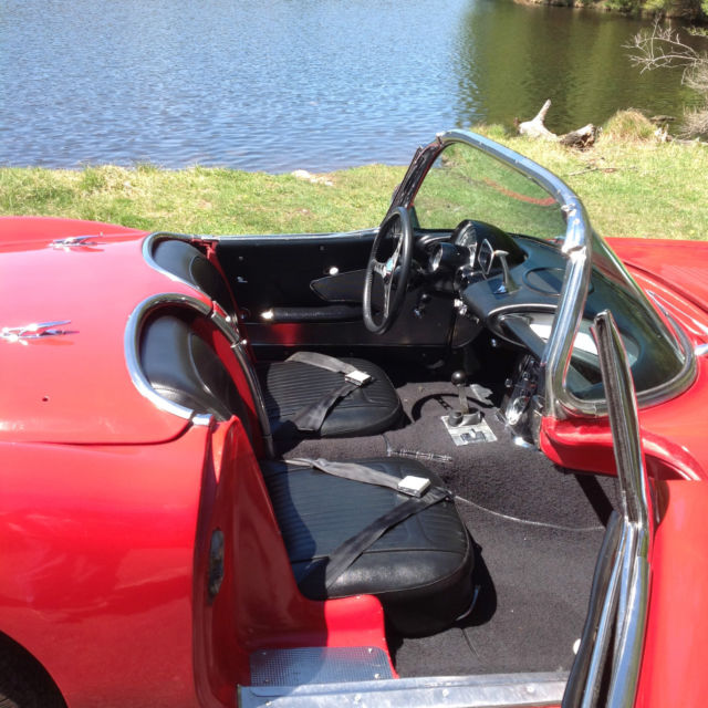1958 red and white Chevrolet Corvette convertible