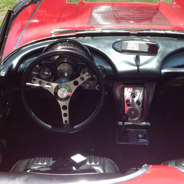 1958 red and white Chevrolet Corvette convertible