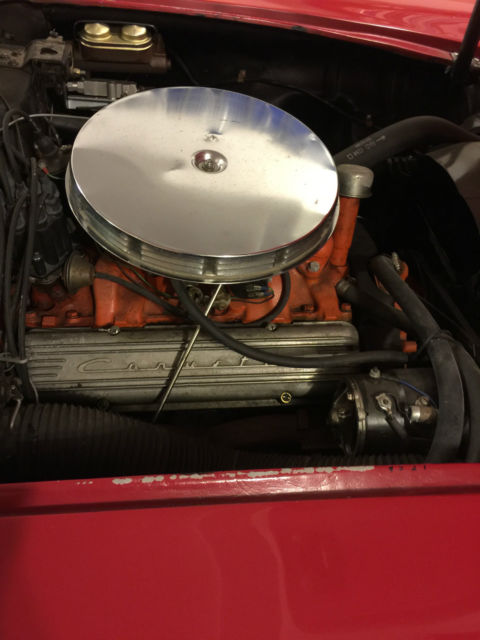 1958 red and white Chevrolet Corvette convertible