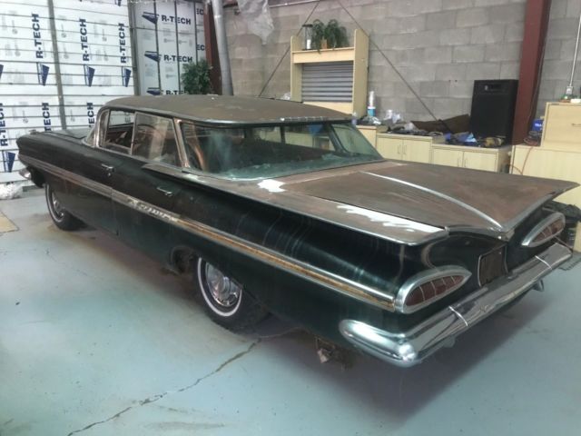 1959 Black body, white on top of roof and deck Chevrolet Impala 4 door hardtop