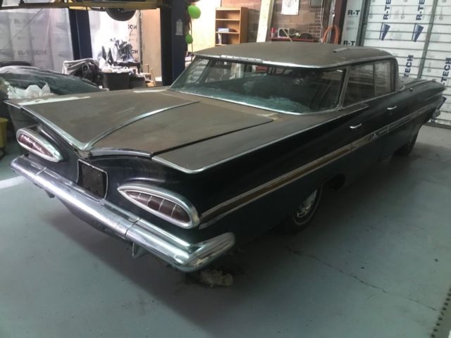 1959 Black body, white on top of roof and deck Chevrolet Impala 4 door hardtop