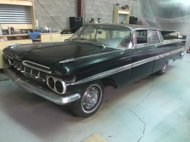 1959 Black body, white on top of roof and deck Chevrolet Impala 4 door hardtop