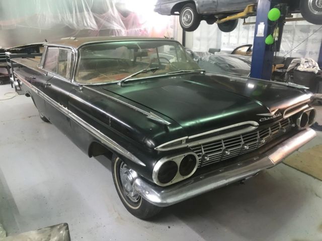 1959 Black body, white on top of roof and deck Chevrolet Impala 4 door hardtop