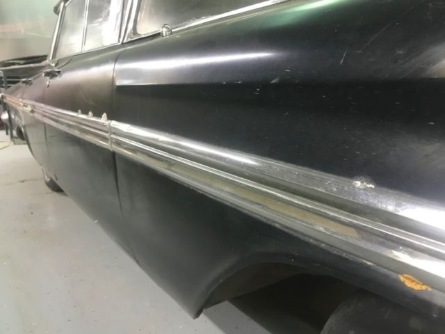 1959 Black body, white on top of roof and deck Chevrolet Impala 4 door hardtop