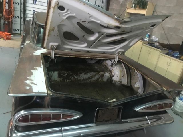 1959 Black body, white on top of roof and deck Chevrolet Impala 4 door hardtop