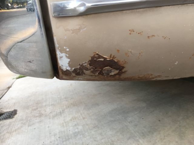 1960 fawn Cadillac DeVille Convertible