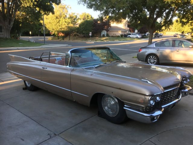 1960 fawn Cadillac DeVille Convertible