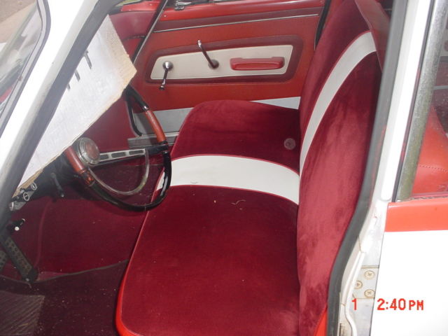 1960 white/red Plymouth Valiant Sedan