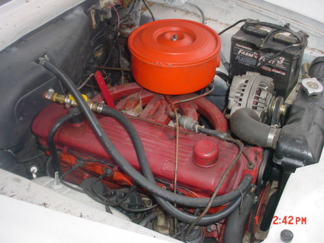 1960 white/red Plymouth Valiant Sedan
