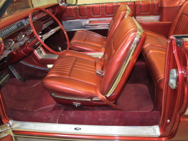1961 Red Oldsmobile Starfire