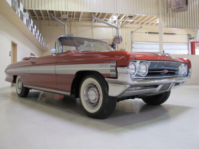 1961 Red Oldsmobile Starfire