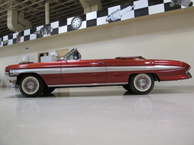 1961 Red Oldsmobile Starfire