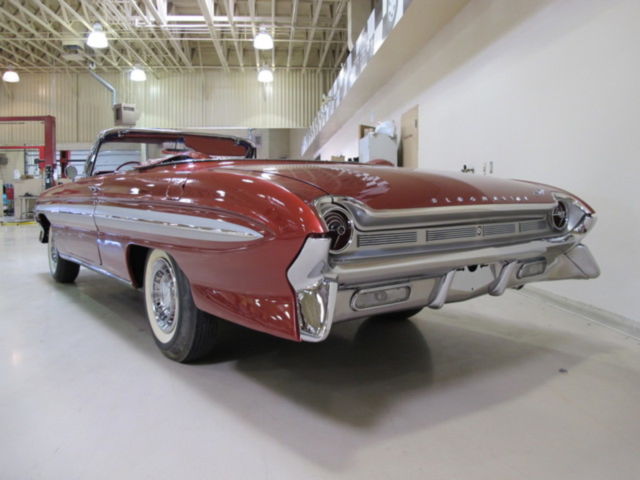 1961 Red Oldsmobile Starfire