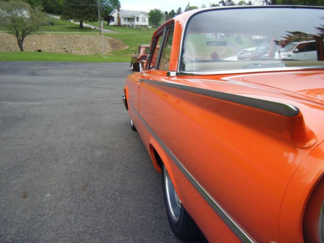 1961 Orange Ford Fairlane Coupe