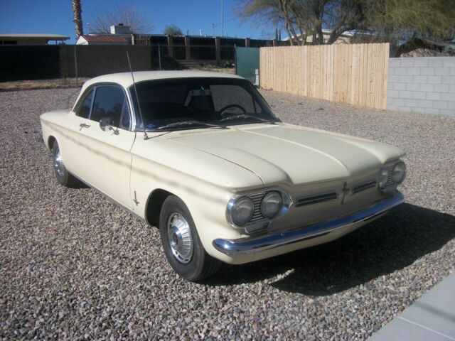 1962 yellow Chevrolet Corvair coupe