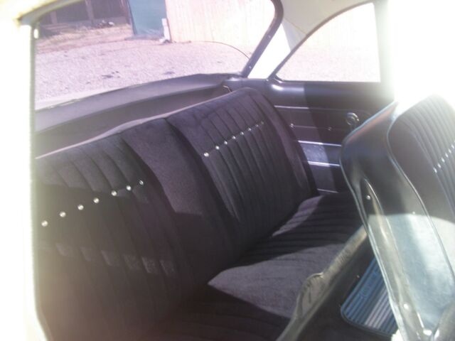 1962 yellow Chevrolet Corvair coupe