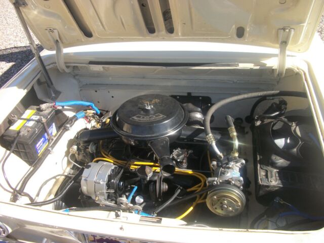 1962 yellow Chevrolet Corvair coupe