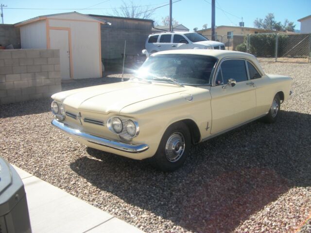1962 yellow Chevrolet Corvair coupe