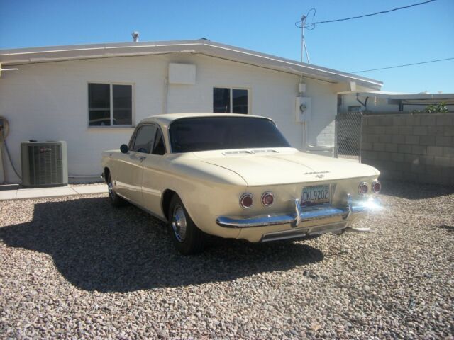 1962 yellow Chevrolet Corvair coupe