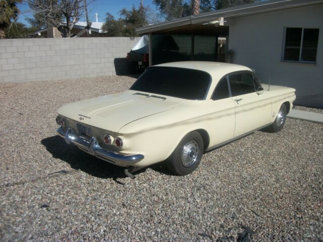 1962 yellow Chevrolet Corvair coupe