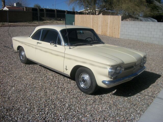 1962 yellow Chevrolet Corvair coupe