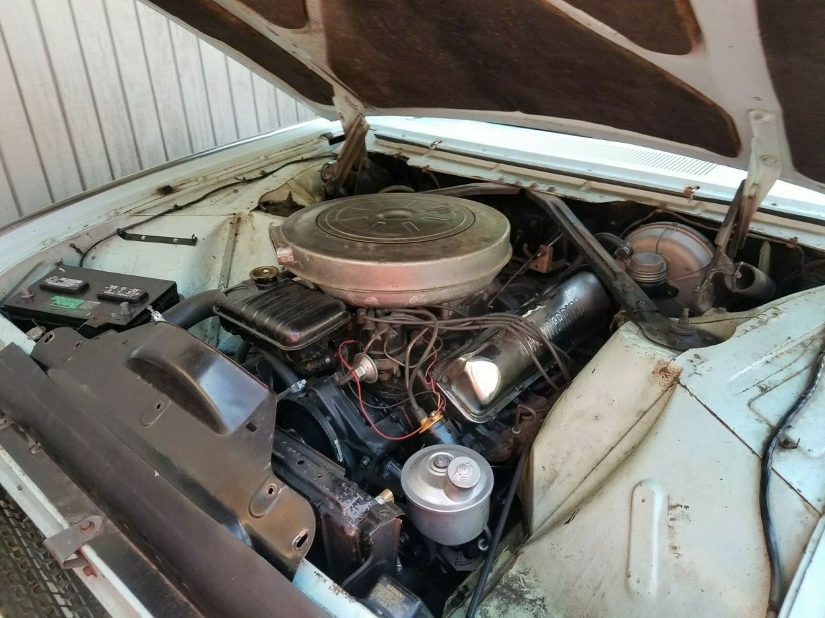 1962 Turquoise Ford Thunderbird Convertible