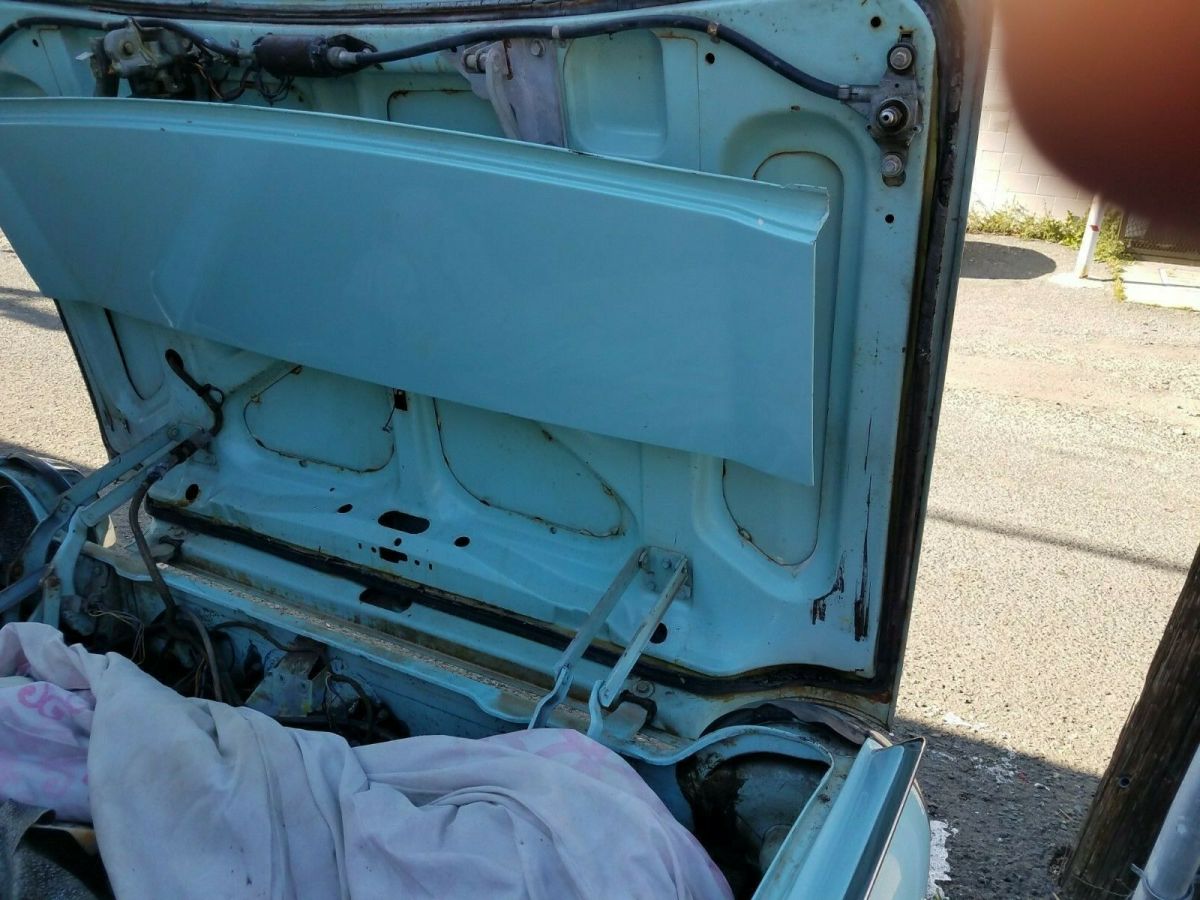 1962 Turquoise Ford Thunderbird Convertible