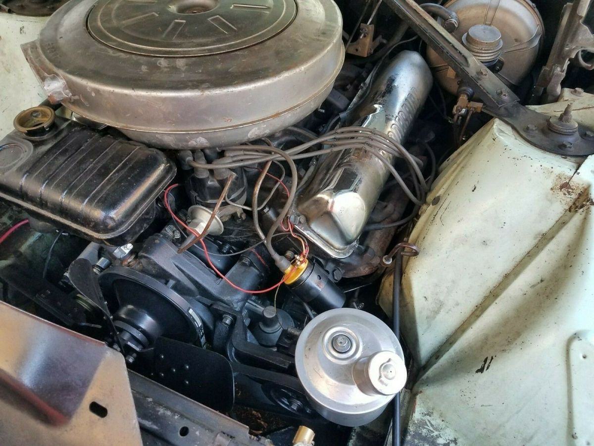 1962 Turquoise Ford Thunderbird Convertible