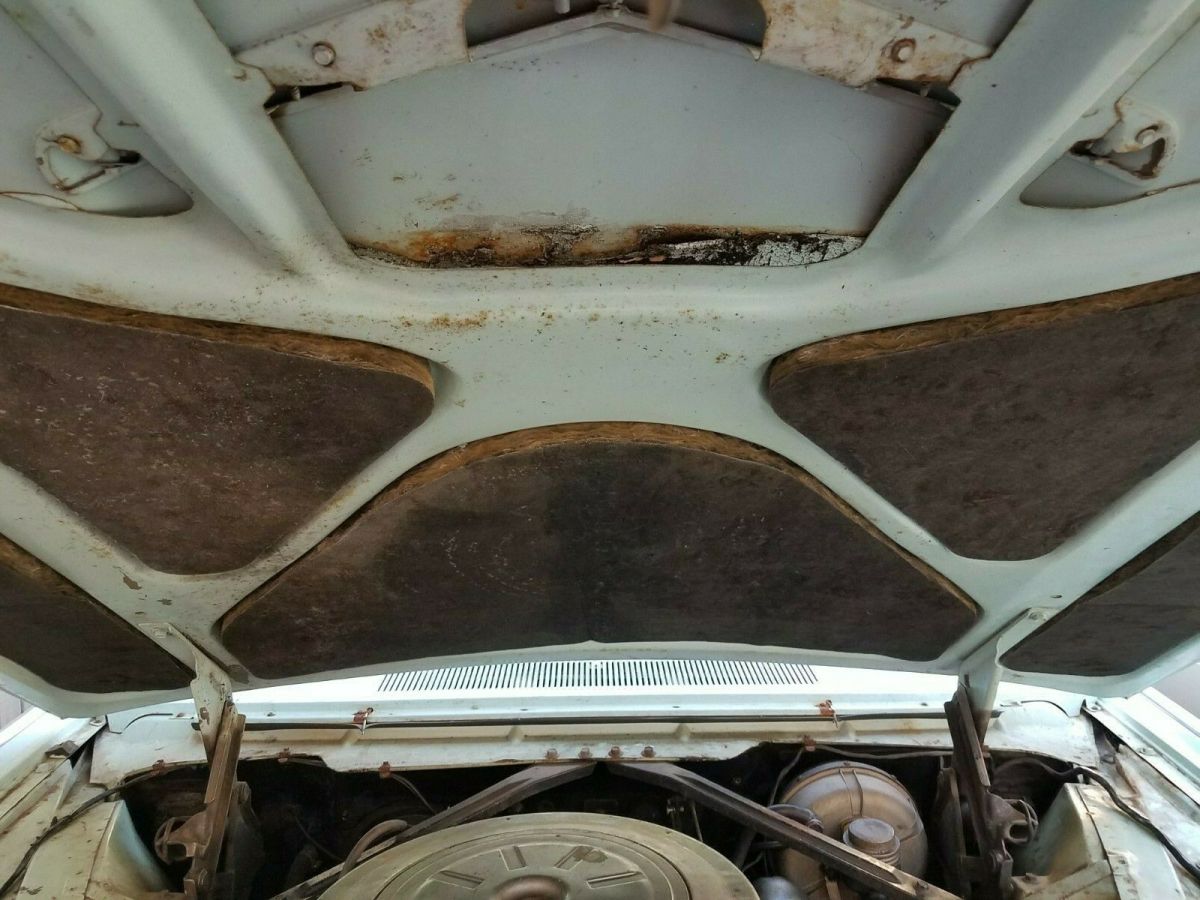 1962 Turquoise Ford Thunderbird Convertible