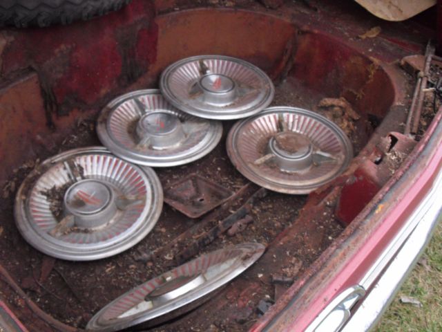 1962 burgundy Oldsmobile Starfire Coupe