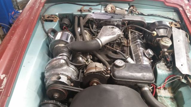 1963 Maroon Studebaker Avanti Coupe