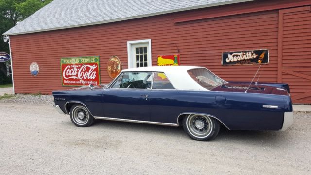 1963 blue body white vinyl top Pontiac Grand Prix Coupe