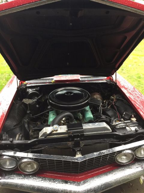 1963 Burgundy Buick Riviera Coupe
