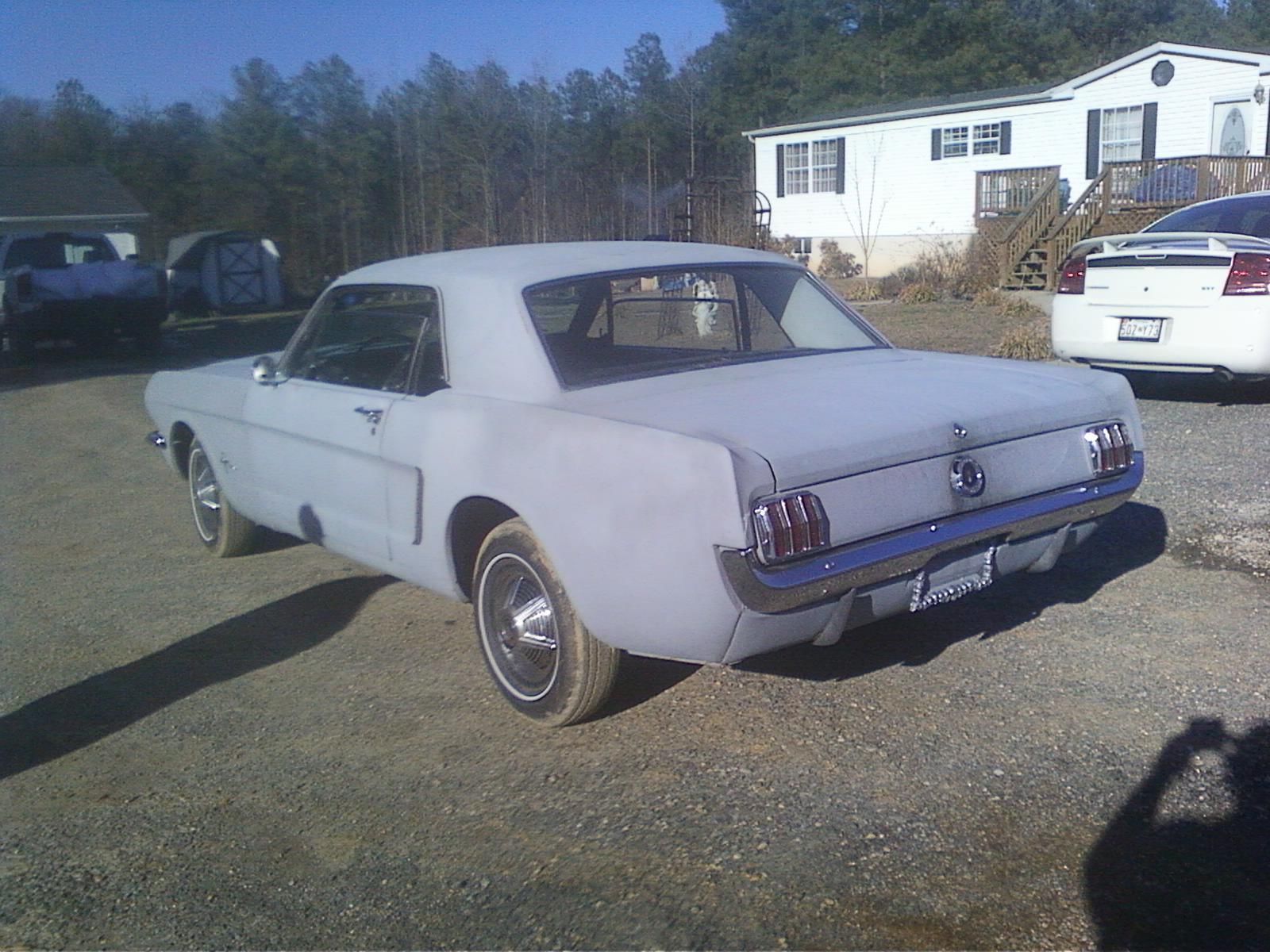 1964 originally red, but now is primered Ford Mustang U/K