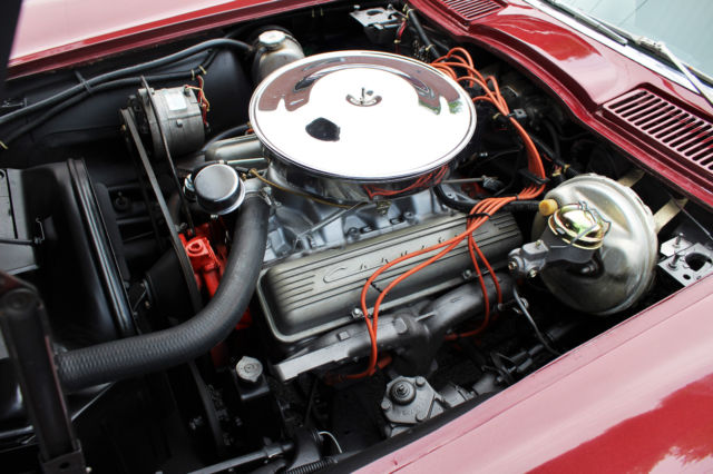 1964 maroon Chevrolet Corvette Convertible