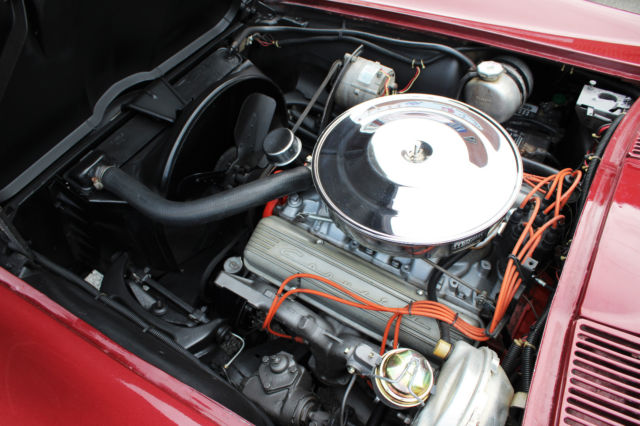 1964 maroon Chevrolet Corvette Convertible