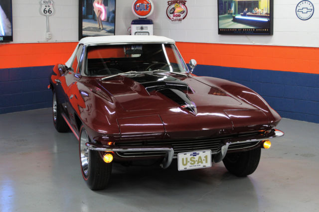 1964 maroon Chevrolet Corvette Convertible