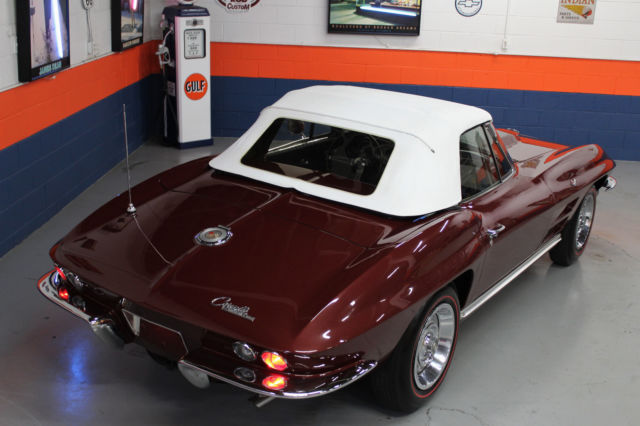 1964 maroon Chevrolet Corvette Convertible