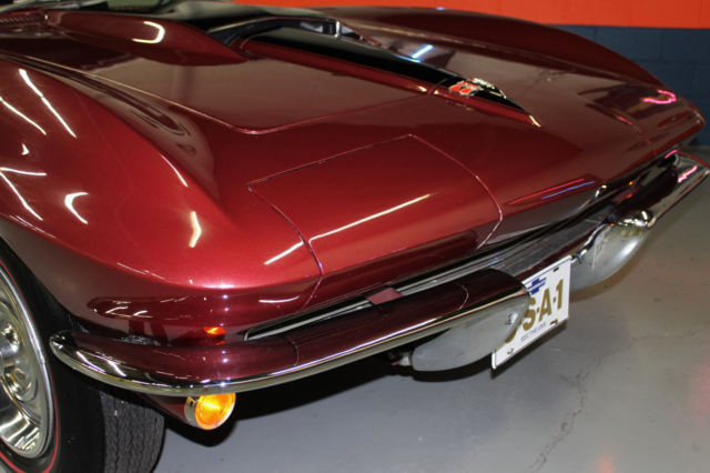 1964 maroon Chevrolet Corvette Convertible