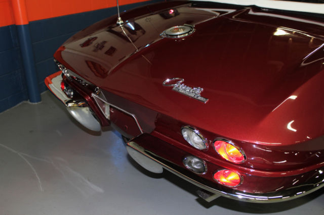 1964 maroon Chevrolet Corvette Convertible