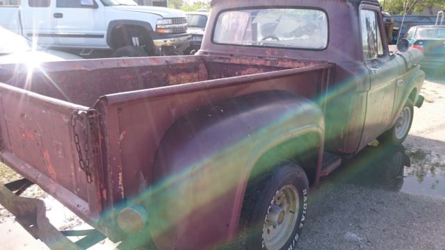 1965 rusty brown Ford F-100 Pickup Truck