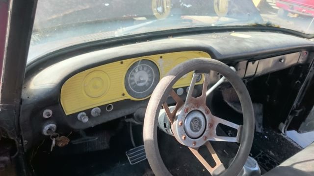 1965 rusty brown Ford F-100 Pickup Truck