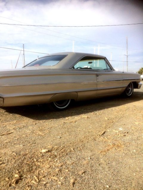 1964 champagne Ford Galaxie Coupe
